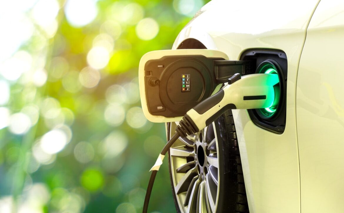 Ev,Car,Or,Electric,Car,At,Charging,Station,With,The